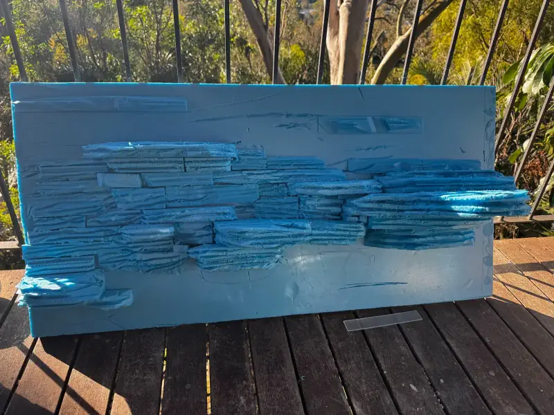 First carve — four-foot layered rock backdrop being made by hand