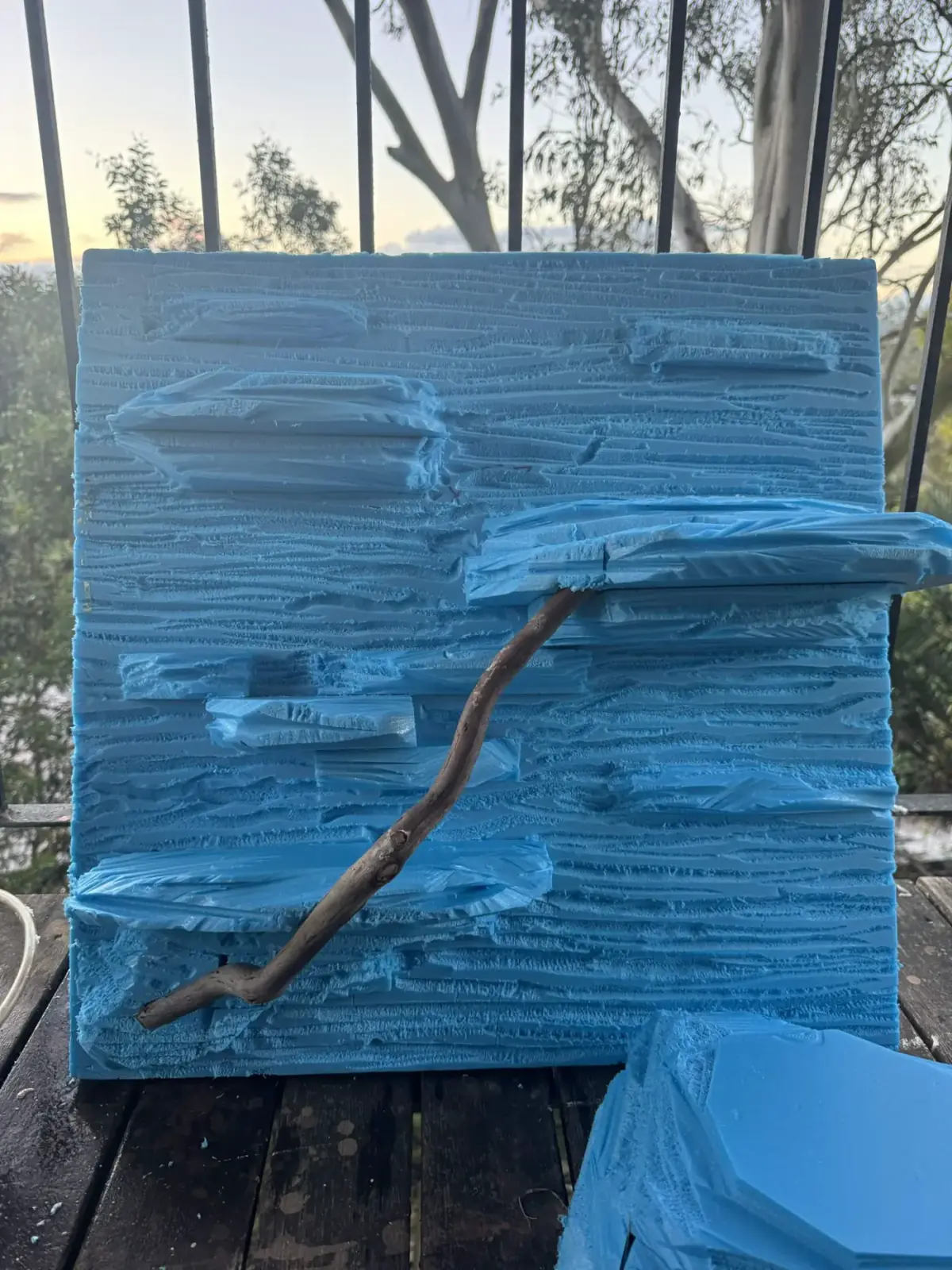 Small handmade blue foam hide being shaped for a Children’s python